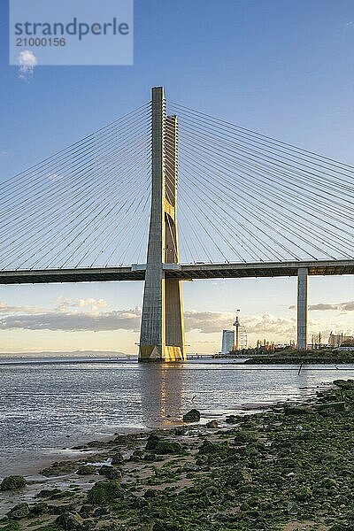 Ponte Vasco da Gama Bridge view near the Rio Tejo river at sunset