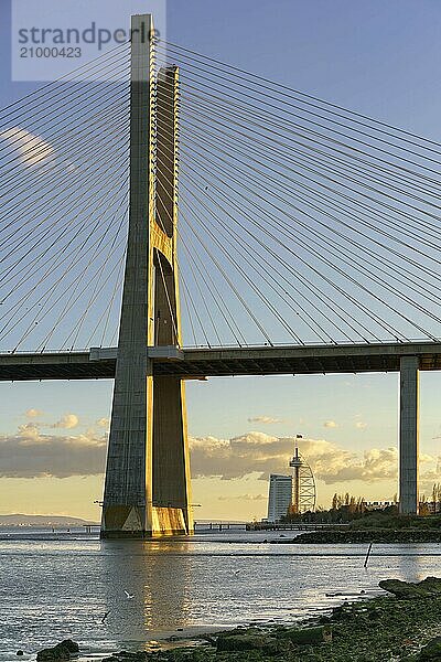 Ponte Vasco da Gama Bridge view near the Rio Tejo river at sunset