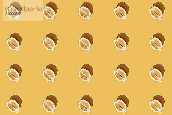 Conceptual pattern with halves of lemon collection with shadow on orange background. Healthy eating  travel or vacation concept