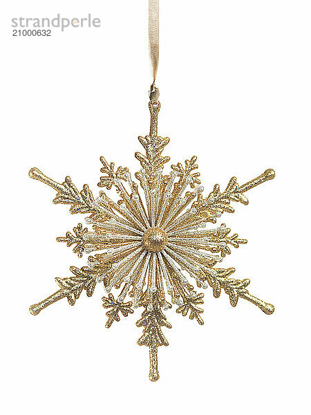 Shiny golden snowflake ornament Christmas tree decoration isolated on white background