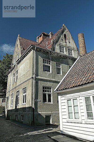 Historic houses in Stavanger against a blue sky  Norway  Europe