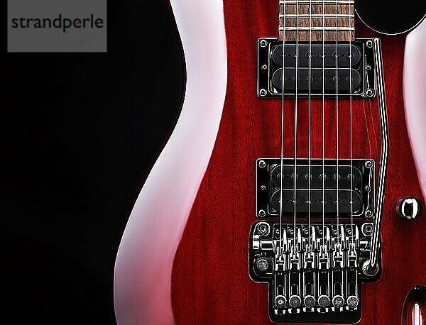 Closeup of red electric guitar Ibanez S-series S420  tremolo and pickups on black background