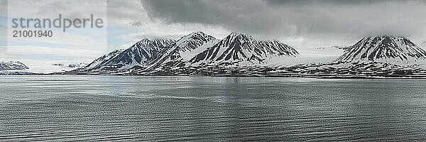 Panoramic mountains in Svalbard islands in a cloudy day  Norway  Europe