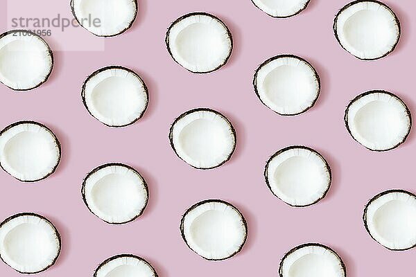 Coconut pattern on the pink background. Set of coconut halves.