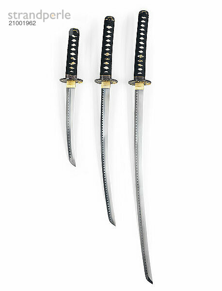 Three Japanese samurai swords  Katana  Wakizashi and Tanto  isolated on white background