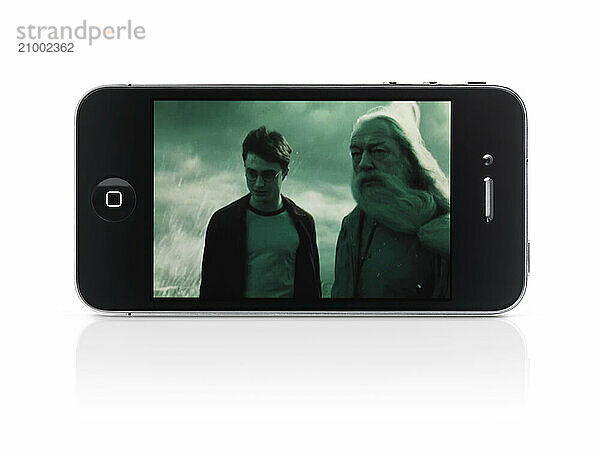 Harry Potter movie on display of Apple iPhone 4 smartphone isolated with clipping path on white background