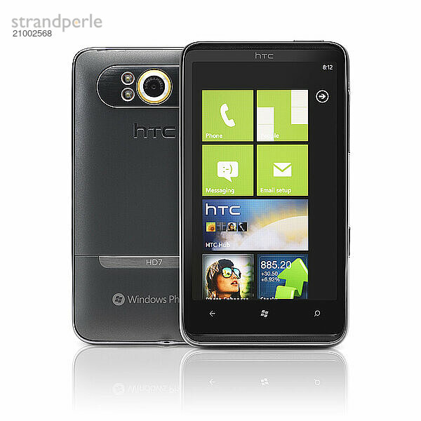 Windows 7 phone. HTC HD7 smartphone. Two phones front and back view isolated with clipping path on white background. High quality photo