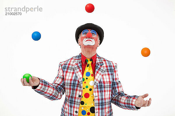 Clown juggling