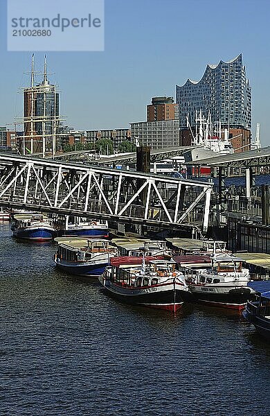 Europe  Germany  Hamburg  Elbe  St. Pauli Landungsbrücken  view of the Elbe Philharmonic Hall  Hamburg's new concert hall  barges for harbour cruises  Hamburg  Hamburg  Federal Republic of Germany  Europe