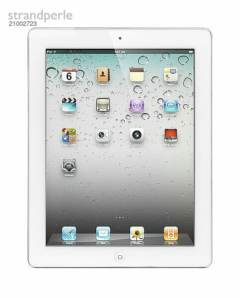 White Apple iPad 2 tablet computer with desktop icons on its display. Isolated with clipping path on white background