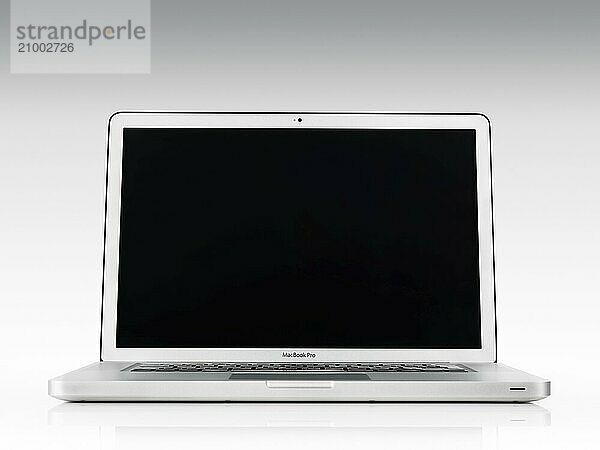 Apple Macbook Pro laptop computer front view with blank screen isolated on white background with clipping path