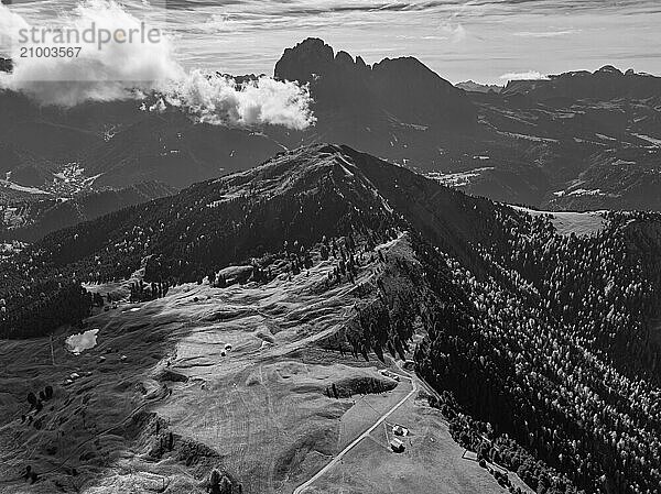 The Picberg  in the background the peaks of the Sassolungo group  shrouded in fog  drone shot  black and white  Val Gardena  Dolomites  Autonomous Province of Bolzano  South Tyrol  Italy  Europe