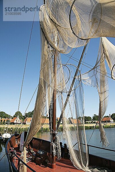 Enkhuizen  Netherlands  June 2022. Traditional fishing boats and nets hanging out to dry at the Zuiderzee Museum in Enkhuizen. Selective focus