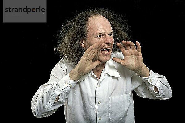 Calling man in white shirt on black background