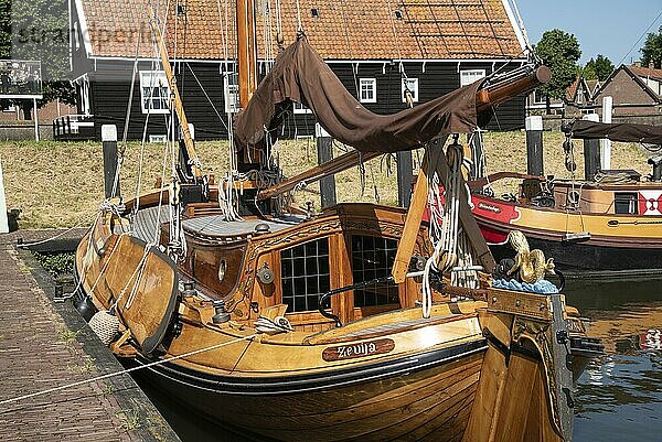 Enkhuizen  Netherlands  June 2022. Old flat-bottomed sailing ships in the harbor of the Zuiderzee Museum in Enkhuizen. Selective focus