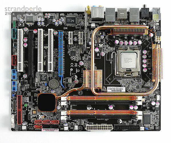 Computer motherboard with a CPU in a socket and extension slots isolated on white