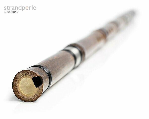 Chinese vertical end-blown bamboo flute Xiao isolated on white background