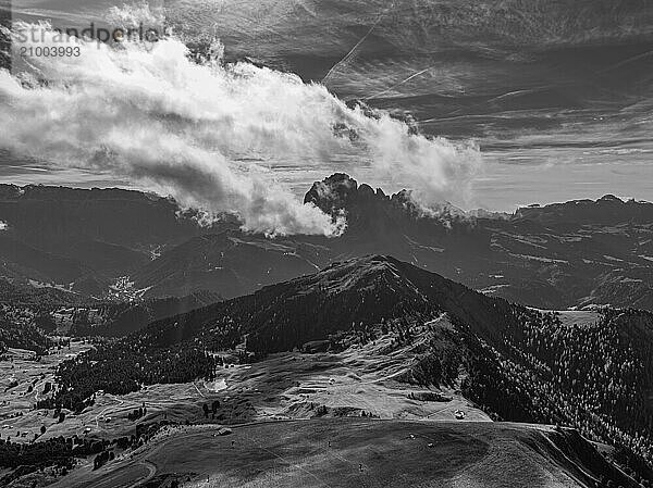 The Picberg  in the background the peaks of the Sassolungo group  shrouded in fog  drone shot  black and white  Val Gardena  Dolomites  Autonomous Province of Bolzano  South Tyrol  Italy  Europe