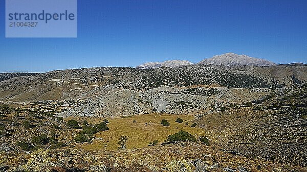 Vast landscape with mountains and sparse vegetation under a bright blue sky  Lefka Ori  White Mountains  mountain massif  West  Crete  Greece  Europe