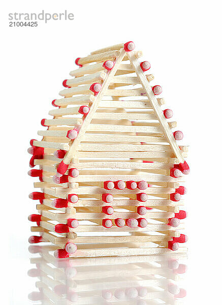 House made from matches Isolated on white background