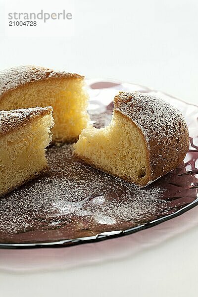 Slices of cake on a plate over a white background