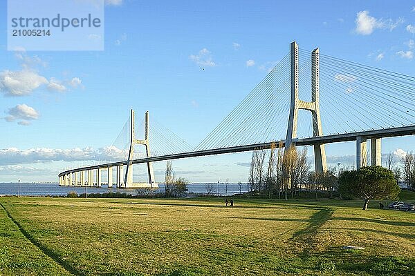 Ponte Vasco da Gama Bridge view from a garden park during the day