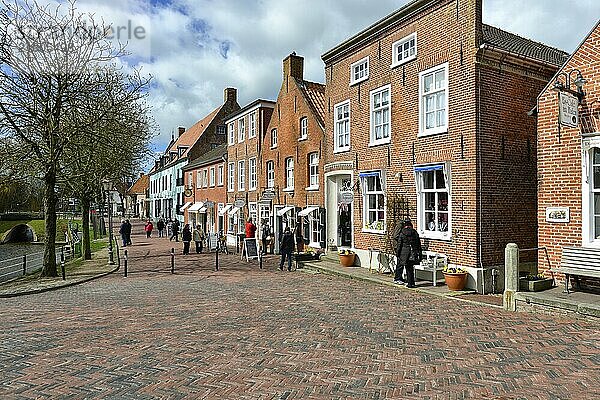 Townscape Greetsiel  Historic Sielstrasse with brick houses  Krummhörn  East Frisia  Lower Saxony  Germany  Europe