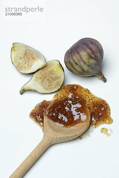 Fig jam in cooking spoon and fresh figs  Ficus carica