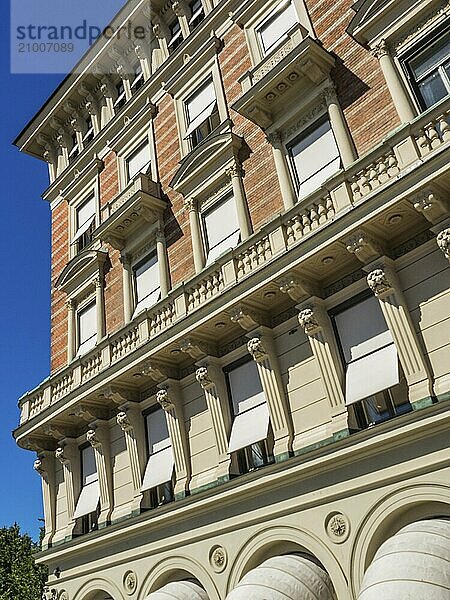 A historic building façade with several windows and decorative elements in sunny weather  stockholm  baltic sea  sweden  scandinavia