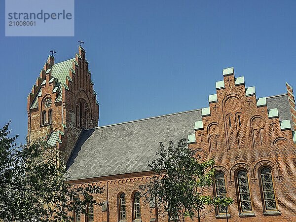 Historic brick village church with a high church tower  trelleborg  sweden  baltic sea  scandinavia