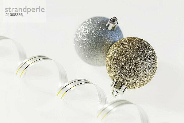 Christmas balls and ribbon on a white background