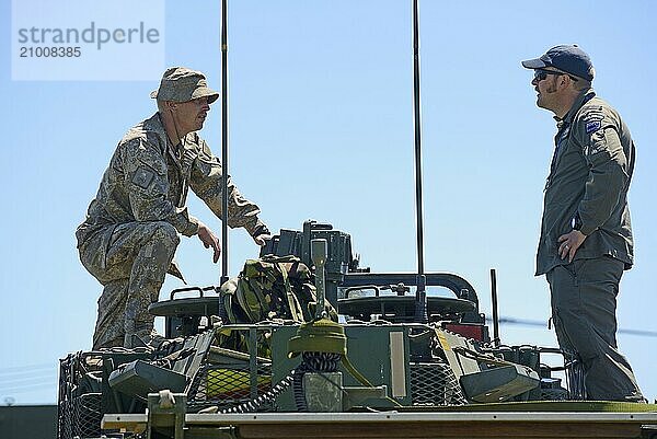 GREYMOUTH  NEW ZEALAND  NOVEMBER 18  2017: Crew members of a Light Armoured Vehicle (LAV) discuss matters at an open day for the military