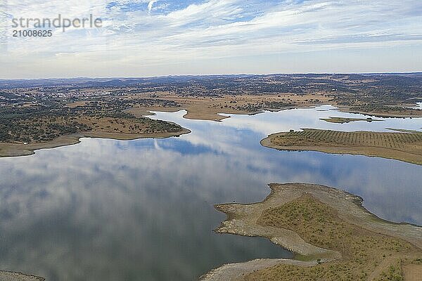 Drone aerial panorama of a dam lake reservoir at sunset in Terena  Portugal  Europe