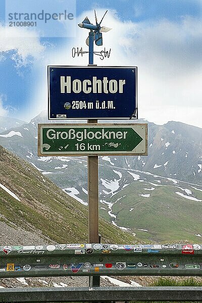 Above small wind wheel for determining wind direction  below information on sign with height indication at highest point of Grossglockner High Alpine Road viewpoint Hochtor  below information about distance to mountain Grossglockner  Grossglockner High Alpine Road  Heiligenblut  Carinthia  Austria  Europe