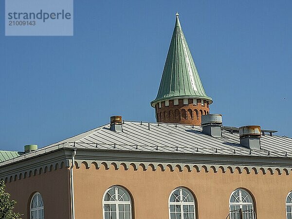 Building with green pointed roof and windows under a clear sky  trelleborg  sweden  baltic sea  scandinavia