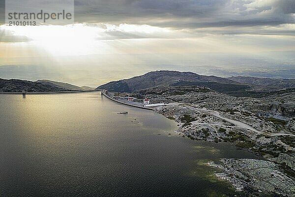 Landscape aerial drone view of Lagoa comprida lake and Marques da Silva dam in Serra da Estrela  Portugal at sunset