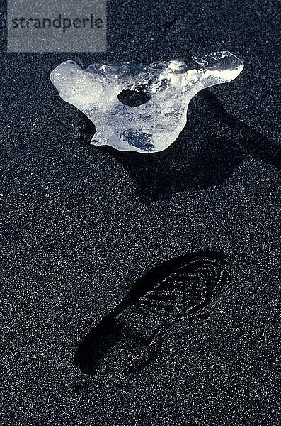 Ice and a shoe print  Alaska  USA.