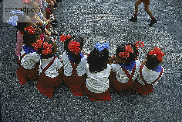 Cuban schoolchildren play a game.