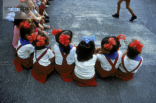 Cuban schoolchildren play a game.