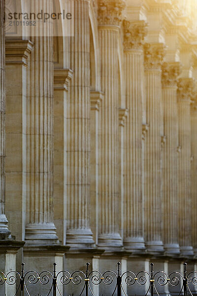 Sunrise sprays off the Louvre's columns