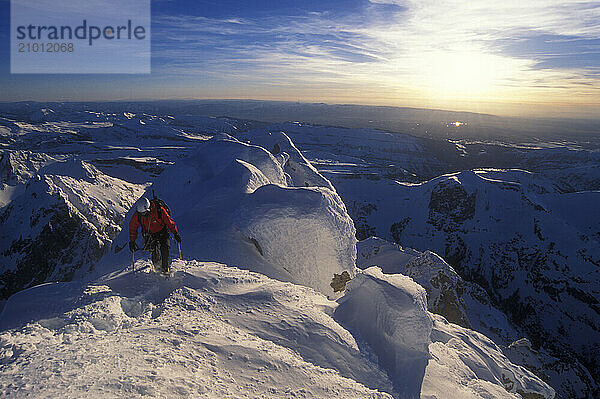 A man climbs the Grand Teton in the winter  Grand Teton National Park  Wyoming.