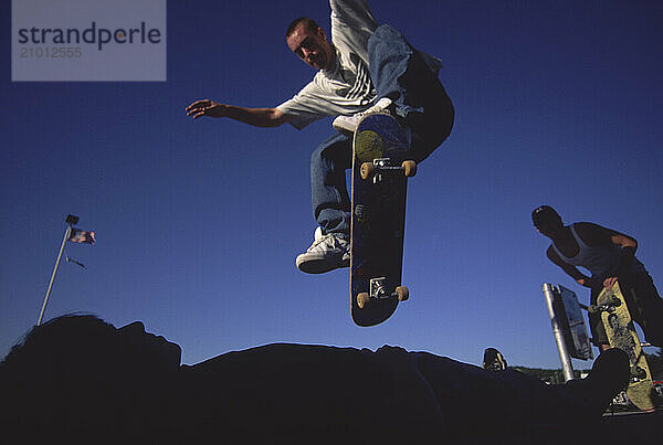 A group of teenagers skateboarding.