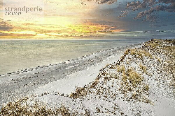 Dramatic sunset at the high dune on the darss. Viewpoint in the national park. Beach  Baltic Sea  sky and sea. Nature shot in Germany