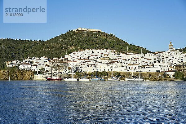 Sanlucar de Guadiana in Spain and Alcoutim in Portugal with sail boats on Guadiana river