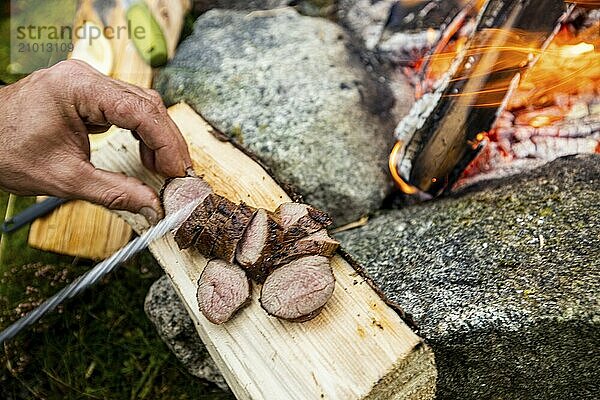 Viddal  More og Romsdal  Norway  cooking  fire  knife  meat  Europe