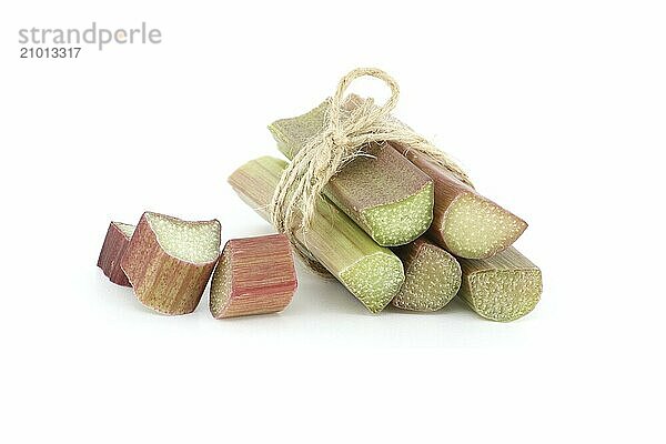 Bunch of freshly cut rhubarb stalks tied together with a string isolated on white background  health benefits of eating rhubarb