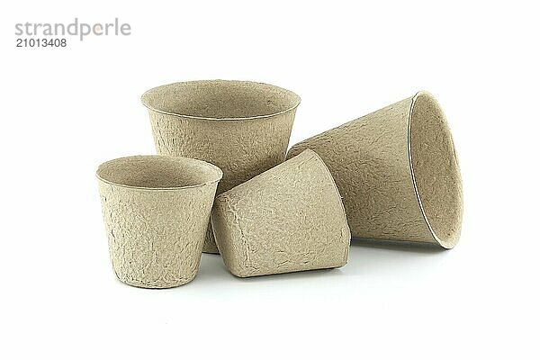 Round plant seed starter peat pots for planting isolated on white background. Biodegradable compost-able nursery pots for vegetables herbs flowers