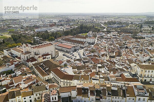 Evora drone aerial view on a sunny day with historic buildings city center and church in Alentejo  Portugal  Europe