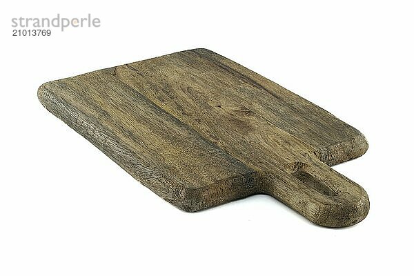 Wooden cutting board with a handle  made from old  thick wood  and bears a rustic  vintage appearance characterized by cracks  scratches  isolated on a white background