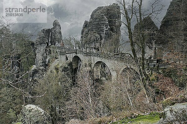 The Bastei Bridge in Saxon Switzerland. jagged rocks  viewing platform overlooking the Elbe. Tourist attraction. Dramatic sky. National park in Germany